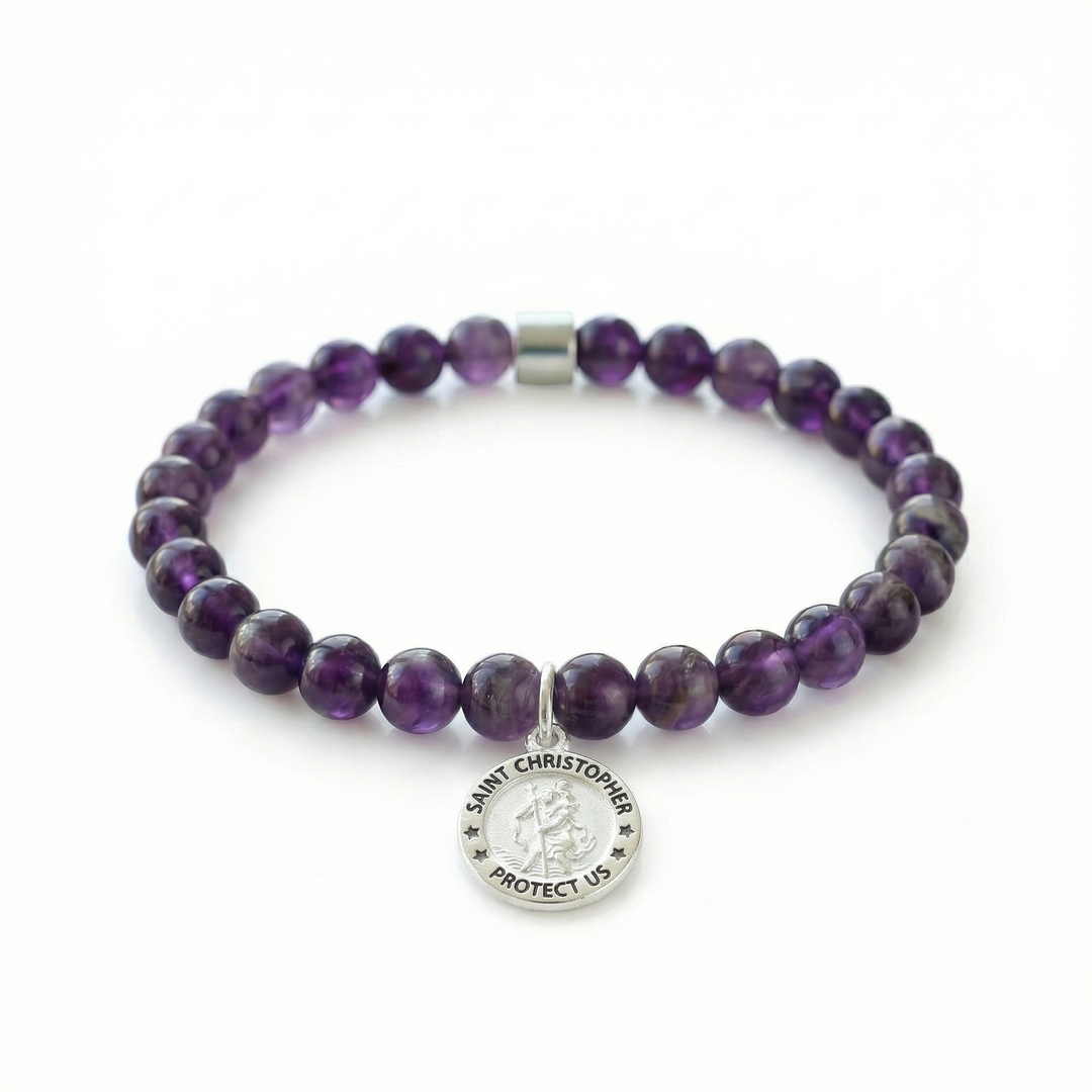 Purple beaded bracelet with a Saint Christopher charm on a white background